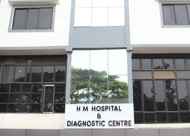The exterior and entrance signage of HM Hospital & Diagnostic Centre, Dibrugarh